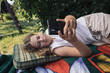 preteen girl relaxing in summer garden, country life in germany