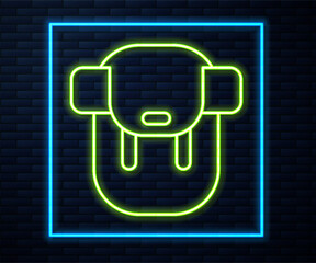 Sticker - Glowing neon line Hiking backpack icon isolated on brick wall background. Camping and mountain exploring backpack. Vector