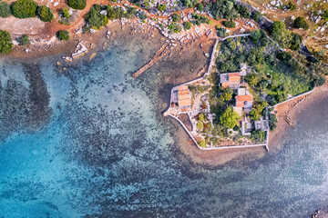 Wall Mural - Aerial view of a villa in fishing village and harbour