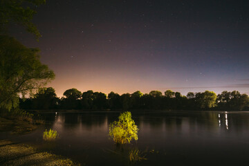 Wall Mural - Starry Night Sky Above River. Concept Of Meditation. Calmness And Serenity. Calm Night. Clear Starry Sky.