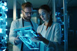 © Rafa Fernandez - Portrait of Two Creative Young Female and Male Engineers Using Tablet. AI Generative
