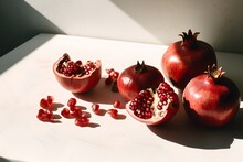 Ripe Pomegranates On A White Background. Still Life.