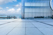 Empty square floor and glass wall with city skyline in sanya, Hainan, China.