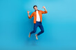 © deagreez - Full length portrait of crazy carefree active man jumping point fingers self himself isolated on blue color background