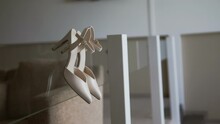 White Women's Shoes With A Pointed Toe. Beige
Heeled Sandals Hang From Glass Railings. Classic Women's Shoes. Stylish Accessory. Wedding Details. Bride Morning. Business Lady. Fees At The Hotel.