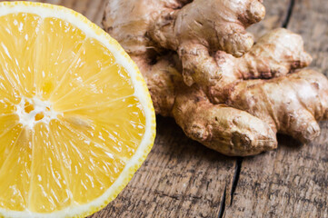 Lemon and ginger in rustic style on wooden background. Organic food. Ingredients for tea