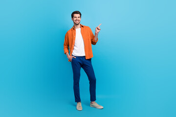 Fototapete - Full size portrait of positive nice person indicate finger empty space news proposition isolated on blue color background