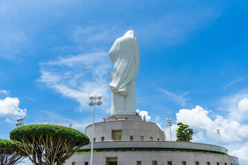 Wall Mural - view of Our lady of Lourdes Virgin Mary catholic religious statue on a Nui Cui mountain in Dong Nai province, Vietnam.