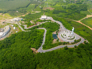 Wall Mural - Aerial view of Our lady of Lourdes Virgin Mary catholic religious statue on a Nui Cui mountain in Dong Nai province, Vietnam.