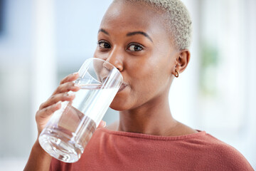 Wall Mural - Health, glass and portrait of a woman drinking water for hydration, wellness and liquid diet. Healthy, h2o and headshot of young African female person enjoying a cold beverage or drink at her home.