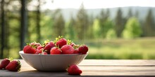 Bowl Juicy Pile Of Red Strawberries On Wooden Table On Blur Forest Background With Copy Space