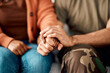 © Daniels C/peopleimages.com - Marriage, holding hands and couple on sofa in therapy for argument, problem advice and divorce counseling. Psychology, mental health and woman with military man on couch for ptsd, help and support