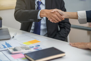 Wall Mural - Executives business partnership handshake in meeting room..