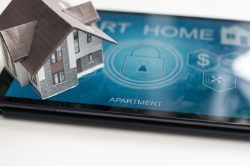 Poster - Small house model is on table and icons home electronics devices connecting with wireless. Smart home controlled and Automation system technology of things