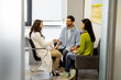 © rh2010 - Psychotherapist or family doctor during a close conversation with adult couple in a medical office. Concept of psychotherapy and family health