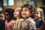 Mixed race group of toddlers, sitting in classroom and looking in awe at their teacher.