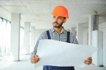 Portrait of a Indian engineer posing at the camera