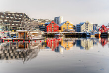 Colorful Houses By The Harbor Mirrored In The Cold Sea At Dawn, Tromso, Norway, Scandinavia