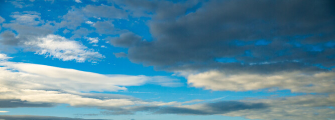 Wall Mural - blue sky with rain storm cloud over ocean shot at 44 mm focal length
