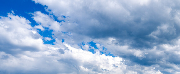 Wall Mural - blue sky with thick clouds shot at 28 mm focal length