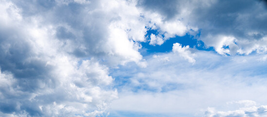 Wall Mural - blue sky with thick clouds shot at 38 mm focal length