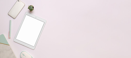 Modern tablet computer with mobile phone and office stationery on light background with space for text