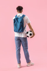 Sticker - Male student with backpack and soccer ball on pink background, back view