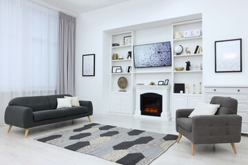 Sticker - Stylish room with beautiful fireplace and comfortable furniture. Interior design