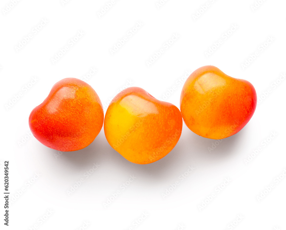 Sweet yellow cherries on white background