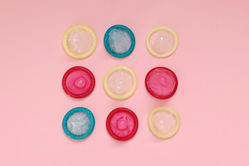 Wall Mural - Condoms on pink background, flat lay. Safe sex