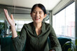 © Wavebreak Media - Happy asian casual businesswoman having video call and gesturing sitting at desk in office