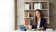 © ArLawKa - Asian female lawyer working in office or court With hammer and justice scales tablet on concept table online legal advice