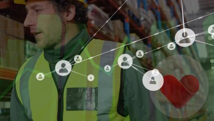 Poster - Animation of connected profile icons, graphs, heart shape over diverse workers talking in warehouse
