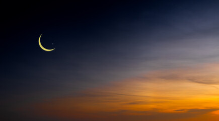 twilight sky with crescent moon and stars, islamic religious concept and ramadan kareem, eid al-fitr