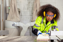 Woman Work In Plywood Wood Panel Modern Furniture Factory. Safety Lady Worker In Wood Workshop. African Black Women Young In Joiner Industry Working People