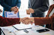 © laddawan - business people shaking hands during a meeting in modern office