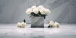 A white marble platform with white roses lining the perimeter of the platform. Funeral concept.