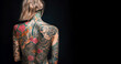 © annebel146 - Tattoo artist woman Portrait of tattooed full body with black background copy space, creative design