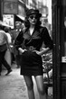 © alexkoral - stylish woman fashionably dressed posing on street. Vintage retro fashion of 1970s and 1980s. Generative AI