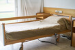 © Robert Kneschke - Blanket and pillow on empty bed in rehabilitation center