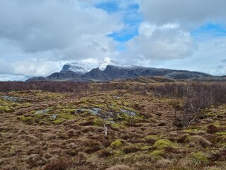 heavy cloud cover over the Dønnamannen mountain seen from the Herøy island