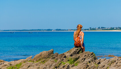 Wall Mural - Woman sitting and enjoying panorama view of the sea- relax woman, travel destination,summer holoday concept