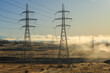© Michael - Rows of high-voltage power pylons on a misty winter morning. Photographed near the Ohau B power plant at Twizel, New Zealand