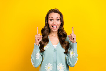 Poster - Photo of excited funky lady dressed teal cardigan open mouth pointing two fingers up emtpy space isolated yellow color background