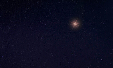 Wall Mural - Single bright star in the sky for the Christmas holiday