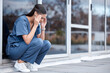 © Tshidzumba/peopleimages.com - Anxiety, doctor or a woman with a headache from healthcare, surgery mistake or death at a hospital. Sad, depressed and a tired female nurse with a migraine or burnout from medical career at a clinic