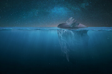 Wall Mural - tip of a drifting iceberg in the water and underwater view on a starry night in the ocean. global wa