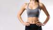 © yusuf - close up shot of fit woman wear gym clothes posing on soft background