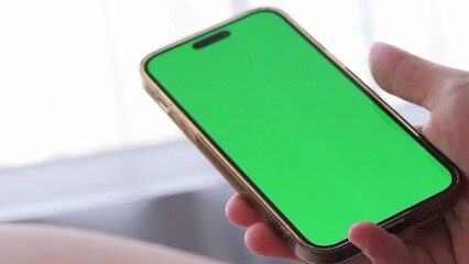 hand holding phone with screen