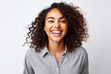 Wall Mural - Portrait of a beautiful young african american woman with curly hair smiling